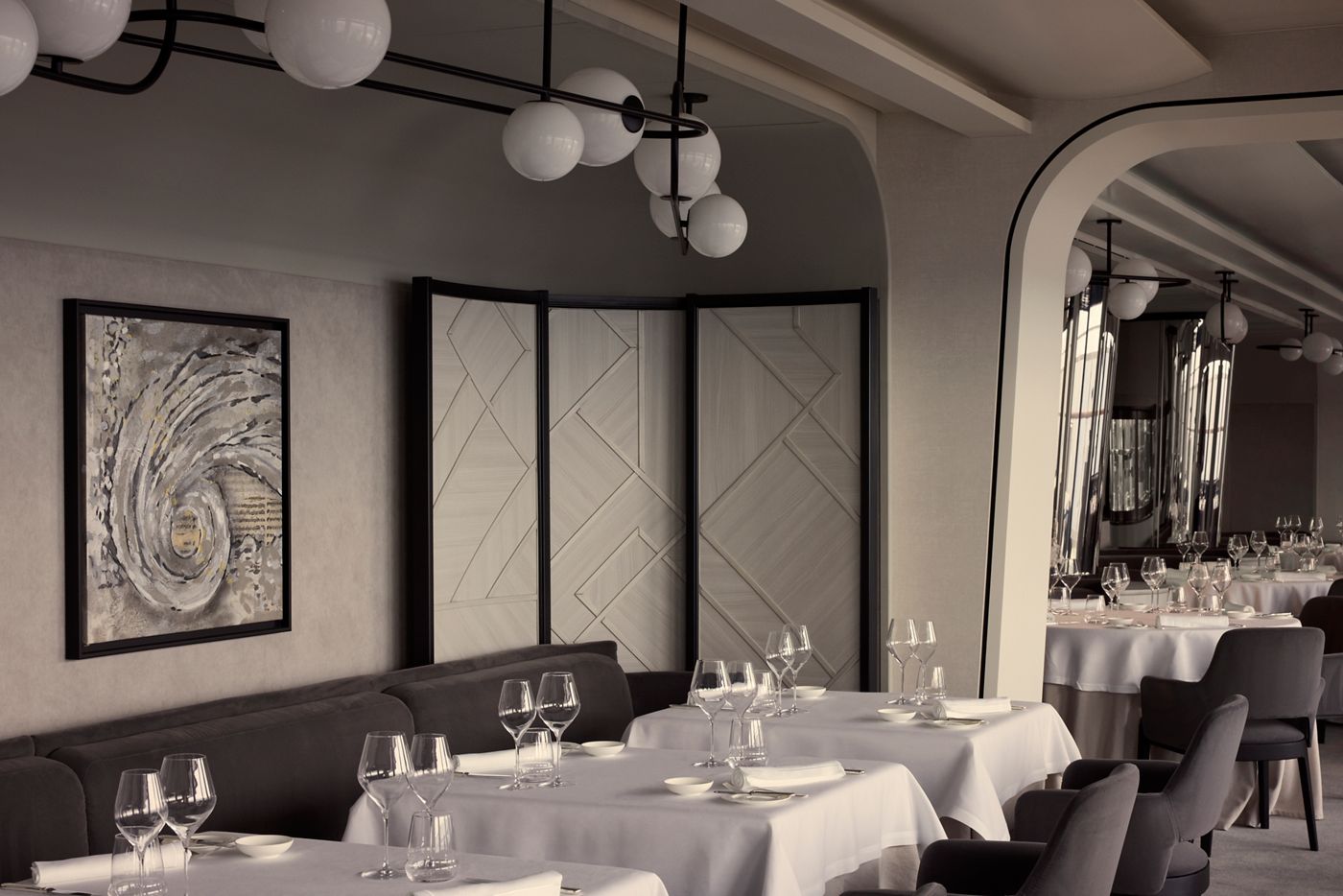 The elegant dining room at Anthology, the fine dining restaurant aboard Explora Journeys