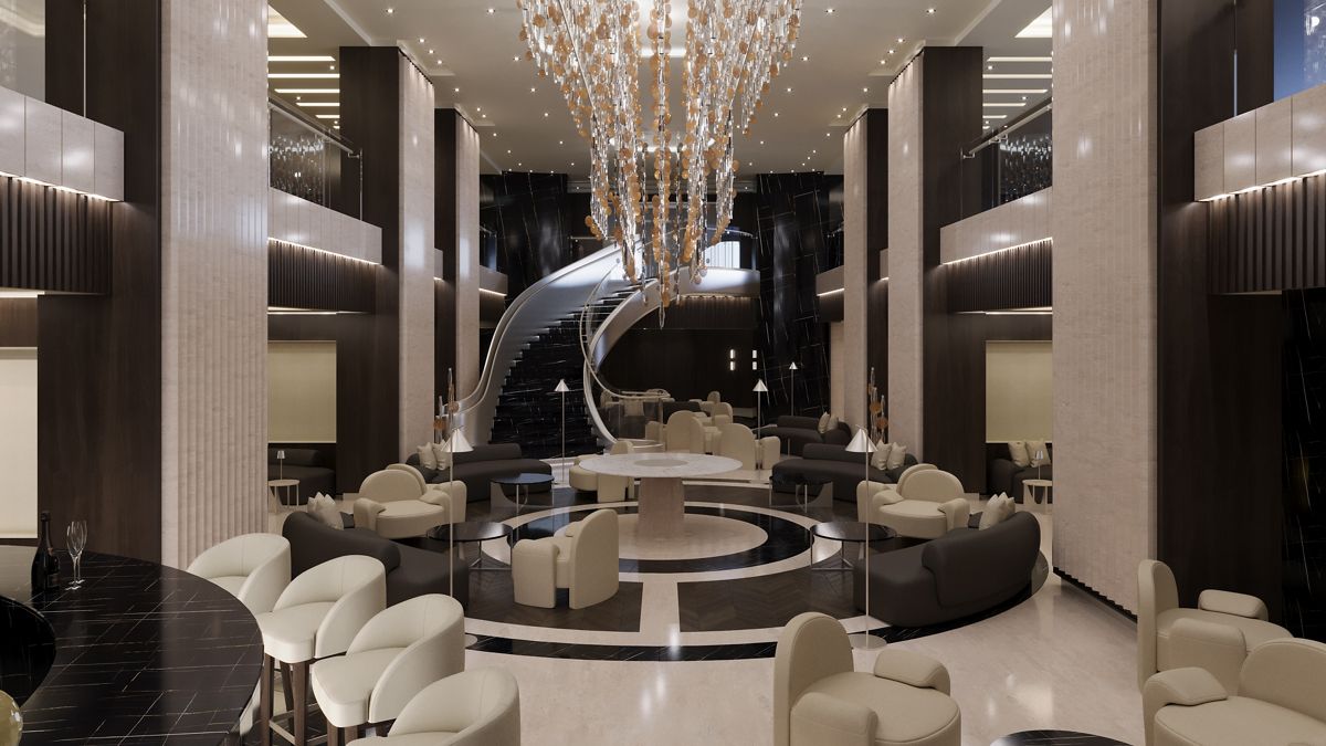 The lobby of an Explora Journeys ship, with a sweeping staircase and soft seating
